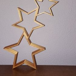 3 goldene Weihnachtssterne zur Dekoration