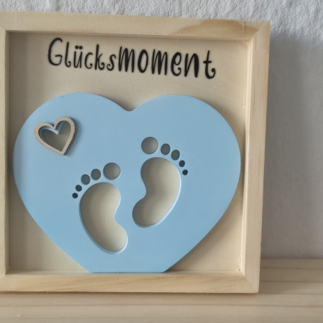 Herz mit Babyfüschen im Bilderrahmen