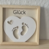 Herz mit Babyfüschen im Bilderrahmen