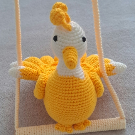 Dekorationsartikel: Vogel auf der Schaukel