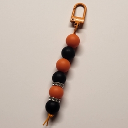 Anhänger schwarz-orange Silikonperlen