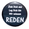 Button 25 mm mit Anstecknadel Spruch Wir müssen reden