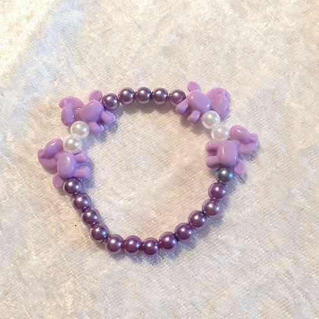 Kinder-Armband Schmuck elastisch Perlen gefädelt Lila mit Ponny