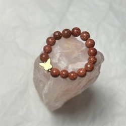 Schöner Ring mit Wüstensandstein und Schmetterling. 