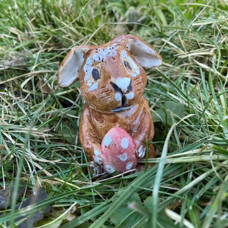 Easter bunny with egg figurine