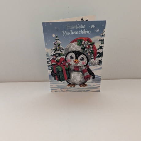Weihnachtskarte mit einem süßen Pinguin