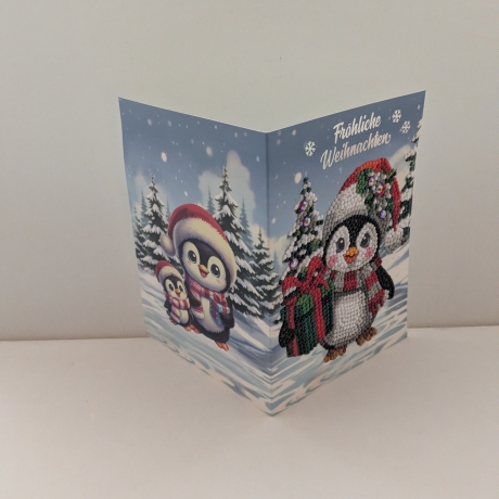 Weihnachtskarte mit einem süßen Pinguin
