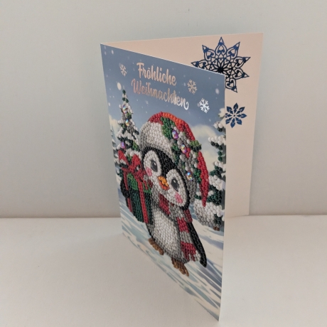 Weihnachtskarte mit einem süßen Pinguin