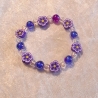 Kinder-Armband Schmuck elastisch Perlen gefädelt Lila mit Blume