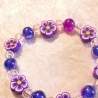 Kinder-Armband Schmuck elastisch Perlen gefädelt Lila mit Blume