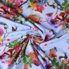 Jersey Blumen Vögel Schmetterlinge hellblau – 150 cm breit