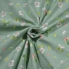 Baumwolljersey Stoff Dina Frühlingswiese mit rosa Blumen auf dunkelmintfarbenem Untergrund | Neue Kollektion 2024