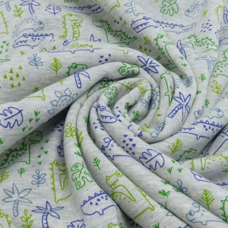 weicher & warmer Alpenfleece Druck mit grünen und blauen Dinosauriern auf hellgrauen Hintergrund