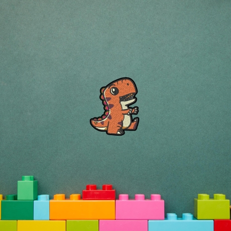 Orange Dinosaurier Patch, zum aufbügeln oder aufnähen, 7.5 cm, gestickte Applikation