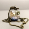Nachtleuchtende Kette mit Muscheln Seegras und Moos