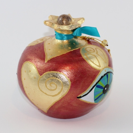 Granatapfel in Rot mit Edelsteinen Blattgold und Glücks Auge